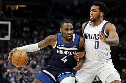 Dec 19, 2021; Minneapolis, Minnesota, USA; Minnesota Timberwolves guard Jaylen Nowell (4) works around Dallas Mavericks guard Sterling Brown (0) in the fourth quarter at Target Center. Mandatory Credit: Bruce Kluckhohn-USA TODAY Sports