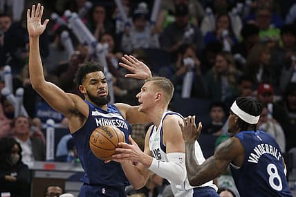 Dec 19, 2021; Minneapolis, Minnesota, USA; Dallas Mavericks forward Kristaps Porzingis (6) looks to go to the basket as Minnesota Timberwolves center Karl-Anthony Towns (32) defends him in the third quarter at Target Center. Mandatory Credit: Bruce Kluckhohn-USA TODAY Sports