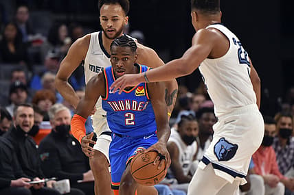 Dec 20, 2021; Memphis, Tennessee, USA; Oklahoma City Thunder guard Shai Gilgeous-Alexander (2) handles the ball against Memphis Grizzlies forward Kyle Anderson (1) and Memphis Grizzlies guard Desmond Bane (22) during the first half  at FedExForum. Mandatory Credit: Justin Ford-USA TODAY Sports