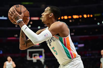 Dec 20, 2021; Los Angeles, California, USA; San Antonio Spurs guard Dejounte Murray shoots against the Los Angeles Clippers during the second half at Staples Center.