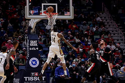 Dec 21, 2021; New Orleans, Louisiana, USA; New Orleans Pelicans forward Brandon Ingram (14) shoots against Portland Trail Blazers forward Robert Covington (33) during the first half at Smoothie King Center. Mandatory Credit: Stephen Lew-USA TODAY Sports