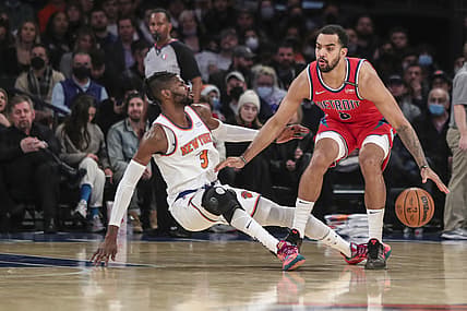 Dec 21, 2021; New York, New York, USA;  Detroit Pistons forward Trey Lyles (8) handles the ball as  New York Knicks center Nerlens Noel (3) falls to the floor in the third quarter at Madison Square Garden. Mandatory Credit: Wendell Cruz-USA TODAY Sports