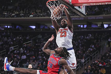 Dec 21, 2021; New York, New York, USA;  New York Knicks center Mitchell Robinson (23) dunks over Detroit Pistons center Isaiah Stewart (28) in the third quarter at Madison Square Garden. Mandatory Credit: Wendell Cruz-USA TODAY Sports