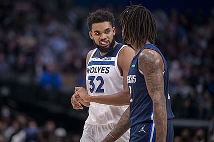 Dec 21, 2021; Dallas, Texas, USA; Minnesota Timberwolves center Karl-Anthony Towns (32) grabs his hand after blocking a shot against the Dallas Mavericks during the second half at the American Airlines Center. Mandatory Credit: Jerome Miron-USA TODAY Sports