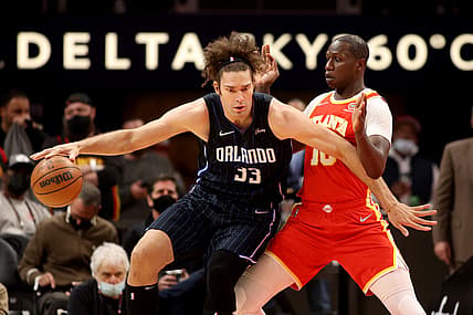 Dec 22, 2021; Atlanta, Georgia, USA; Orlando Magic center Robin Lopez (33) makes a move against Atlanta Hawks center Gorgui Dieng (10) during the first quarter at State Farm Arena. Mandatory Credit: Jason Getz-USA TODAY Sports