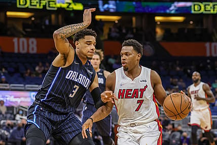 Dec 17, 2021; Orlando, Florida, USA; Miami Heat guard Kyle Lowry (7) drives around Orlando Magic forward Chuma Okeke (3) during the first quarter at Amway Center. Mandatory Credit: Mike Watters-USA TODAY Sports