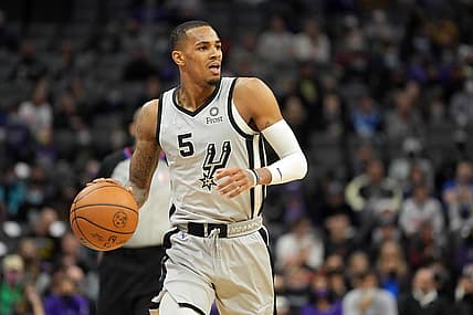 Dec 19, 2021; Sacramento, California, USA; San Antonio Spurs guard Dejounte Murray (5) dribbles during the second quarter against the Sacramento Kings at Golden 1 Center. Mandatory Credit: Darren Yamashita-USA TODAY Sports