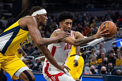 Dec 23, 2021; Indianapolis, Indiana, USA; Houston Rockets center Christian Wood (35) drives to the basket while Indiana Pacers center Myles Turner (33) defends in the first quarter at Gainbridge Fieldhouse. Mandatory Credit: Trevor Ruszkowski-USA TODAY Sports