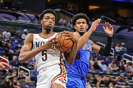 Dec 23, 2021; Orlando, Florida, USA; New Orleans Pelicans forward Herbert Jones (5) and Orlando Magic forward Aleem Ford (11) battle for a rebound during the first quarter at Amway Center. Mandatory Credit: Mike Watters-USA TODAY Sports