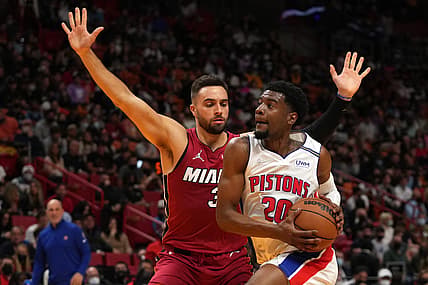Dec 23, 2021; Miami, Florida, USA; Detroit Pistons guard Josh Jackson (20) drives the ball around Miami Heat guard Max Strus (31) during the first half at FTX Arena. Mandatory Credit: Jasen Vinlove-USA TODAY Sports