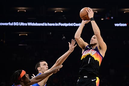 Dec 23, 2021; Phoenix, Arizona, USA; Phoenix Suns guard Devin Booker (1) shoots the ball against the Oklahoma City Thunder during the first half at Footprint Center. Mandatory Credit: Joe Camporeale-USA TODAY Sports