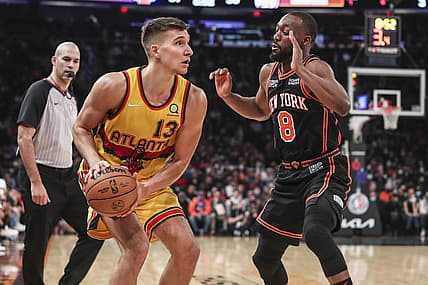 Dec 25, 2021; New York, New York, USA;  Atlanta Hawks guard Bogdan Bogdanovic (13) is guarded by New York Knicks guard Kemba Walker (8) in the second quarter at Madison Square Garden. Mandatory Credit: Wendell Cruz-USA TODAY Sports