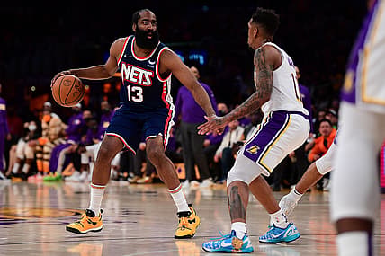 Dec 25, 2021; Los Angeles, California, USA; Brooklyn Nets guard James Harden (13) controls the ball against Los Angeles Lakers guard Malik Monk (11) during the first half at Crypto.com Arena. Mandatory Credit: Gary A. Vasquez-USA TODAY Sports
