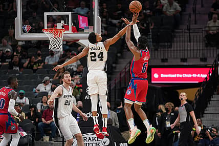 Dec 26, 2021; San Antonio, Texas, USA;  San Antonio Spurs guard Devin Vassell (24) blocks a shot by Detroit Pistons guard Hamidou Diallo (6) in the first half at the AT&T Center. Mandatory Credit: Daniel Dunn-USA TODAY Sports