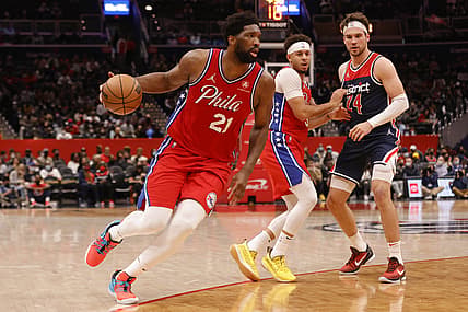 Dec 26, 2021; Washington, District of Columbia, USA; Philadelphia 76ers center Joel Embiid (21) drives to the basket past Washington Wizards forward Corey Kispert (24) during the second quarter at Capital One Arena. Mandatory Credit: Geoff Burke-USA TODAY Sports
