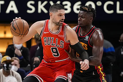 Dec 27, 2021; Atlanta, Georgia, USA; Chicago Bulls center Nikola Vucevic (9) tries to get to the basket guarded by Atlanta Hawks center Clint Capela (15) during the first half at State Farm Arena. Mandatory Credit: Dale Zanine-USA TODAY Sports