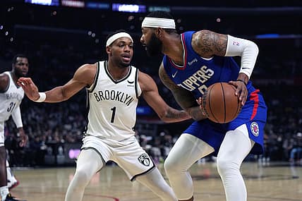 Dec 27, 2021; Los Angeles, California, USA; LA Clippers forward Marcus Morris Sr. (right) controls the ball while defended by Brooklyn Nets forward Bruce Brown (1) in the first half at Crypto.com Arena. Mandatory Credit: Kirby Lee-USA TODAY Sports