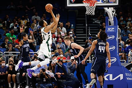 Dec 28, 2021; Orlando, Florida, USA; Milwaukee Bucks forward Giannis Antetokounmpo (34) shoots the ball past Orlando Magic guard R.J. Hampton (13) in the first half at Amway Center. Mandatory Credit: Nathan Ray Seebeck-USA TODAY Sports