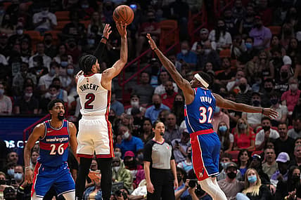 Dec 28, 2021; Miami, Florida, USA; Miami Heat guard Gabe Vincent (2) shoots the ball over Washington Wizards guard Craig Sword (32) during the first half at FTX Arena. Mandatory Credit: Jasen Vinlove-USA TODAY Sports