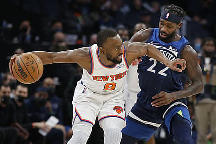 Dec 28, 2021; Minneapolis, Minnesota, USA; New York Knicks guard Kemba Walker (8) looks for a pass as Minnesota Timberwolves guard Patrick Beverley (22) defends him in the fourth quarter at Target Center. Mandatory Credit: Bruce Kluckhohn-USA TODAY Sports