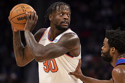 Dec 29, 2021; Detroit, Michigan, USA; New York Knicks forward Julius Randle (30) gets defended by Detroit Pistons guard Derrick Walton Jr. (25) during the second quarter at Little Caesars Arena. Mandatory Credit: Raj Mehta-USA TODAY Sports