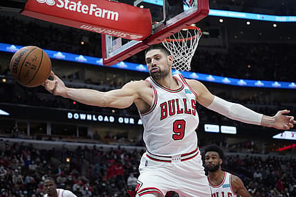 Dec 29, 2021; Chicago, Illinois, USA; Chicago Bulls center Nikola Vucevic (9) grabs a rebound against the Atlanta Hawks during the second half at United Center. Mandatory Credit: David Banks-USA TODAY Sports