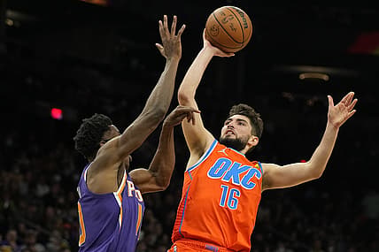 Dec 29, 2021; Phoenix, Arizona, USA; Oklahoma City Thunder guard Ty Jerome (16) shoots over Phoenix Suns forward Jalen Smith (10) in the second half at Footprint Center. Mandatory Credit: Rick Scuteri-USA TODAY Sports