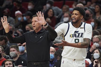 Dec 29, 2021; Portland, Oregon, USA; Utah Jazz forward Rudy Gay (8) and coach Quin Snyder exchange words with a player during the second half against the Portland Trail Blazers at Moda Center. The Jazz won the game 120-105. Mandatory Credit: Troy Wayrynen-USA TODAY Sports
