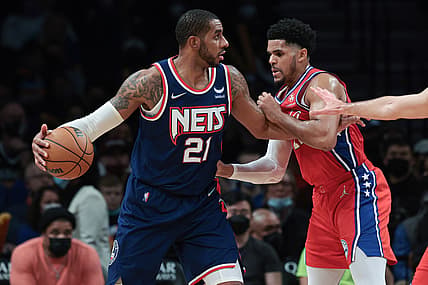 Dec 30, 2021; Brooklyn, New York, USA; Brooklyn Nets center LaMarcus Aldridge (21) dribbles against Philadelphia 76ers forward Tobias Harris (12) during the first half at Barclays Center. Mandatory Credit: Vincent Carchietta-USA TODAY Sports