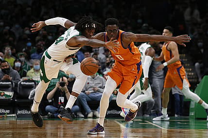 Dec 31, 2021; Boston, Massachusetts, USA; Boston Celtics center Robert Williams III (44) plays for the ball against Phoenix Suns forward Emanuel Terry (10) during the first half at TD Garden. Mandatory Credit: Winslow Townson-USA TODAY Sports