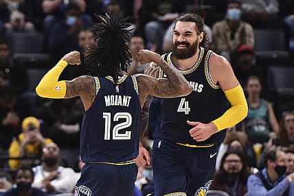 Dec 31, 2021; Memphis, Tennessee, USA; Memphis Grizzlies center Steven Adams (4) and guard Ja Morant (12) celebrate during the first half against the San Antonio Spurs at FedExForum. Mandatory Credit: Justin Ford-USA TODAY Sports