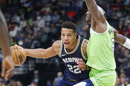 Nov 20, 2021; Minneapolis, Minnesota, USA; Memphis Grizzlies forward Desmond Bane (22) drives around Minnesota Timberwolves forward Jarred Vanderbilt (8) in the third quarter at Target Center. Mandatory Credit: Bruce Kluckhohn-USA TODAY Sports