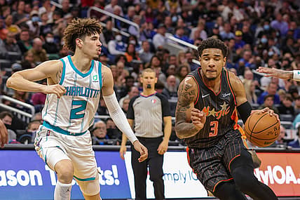 Nov 24, 2021; Orlando, Florida, USA; Orlando Magic forward Chuma Okeke (3) drives around Charlotte Hornets guard LaMelo Ball (2) during the second half at Amway Center. Mandatory Credit: Mike Watters-USA TODAY Sports