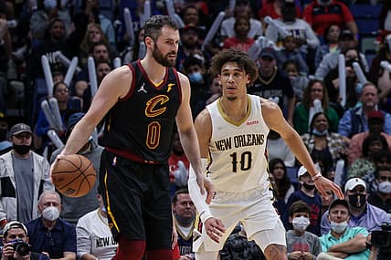 Dec 28, 2021; New Orleans, Louisiana, USA; Cleveland Cavaliers forward Kevin Love (0) dribbles against New Orleans Pelicans center Jaxson Hayes (10) during the second half at Smoothie King Center. Mandatory Credit: Stephen Lew-USA TODAY Sports
