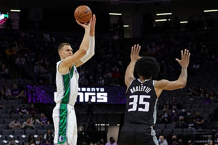 Dec 31, 2021; Sacramento, California, USA; Dallas Mavericks center Kristaps Porzingis (6) shoots the ball over Sacramento Kings forward Marvin Bagley III (35) during the first quarter at Golden 1 Center. Mandatory Credit: Sergio Estrada-USA TODAY Sports