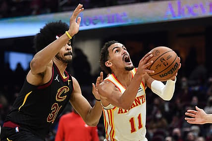 Dec 31, 2021; Cleveland, Ohio, USA; Atlanta Hawks guard Trae Young (11) drives to the basket against Cleveland Cavaliers center Jarrett Allen (31) during the first half at Rocket Mortgage FieldHouse. Mandatory Credit: Ken Blaze-USA TODAY Sports