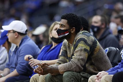 Jan 1, 2022; Newark, New Jersey, USA; Brooklyn Nets guard Kyrie Irving watches from the stands during the first half of the game between the Seton Hall Pirates and the Villanova Wildcats at Prudential Center. Mandatory Credit: Vincent Carchietta-USA TODAY Sports