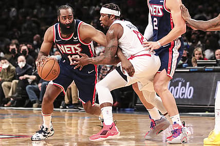 Jan 1, 2022; Brooklyn, New York, USA;  Brooklyn Nets guard James Harden (13) drives against LA Clippers guard Eric Bledsoe (12) in the second quarter at Barclays Center. Mandatory Credit: Wendell Cruz-USA TODAY Sports