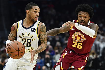 Jan 2, 2022; Cleveland, Ohio, USA; Indiana Pacers guard Keifer Sykes (28) drives to the basket against Cleveland Cavaliers guard Brandon Goodwin (26) during the first half at Rocket Mortgage FieldHouse. Mandatory Credit: Ken Blaze-USA TODAY Sports