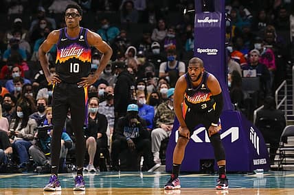 Jan 2, 2022; Charlotte, North Carolina, USA; Phoenix Suns forward Jalen Smith (10) and guard Chris Paul (3) look on against the Charlotte Hornets during the second half at the Spectrum Center. Mandatory Credit: Jim Dedmon-USA TODAY Sports