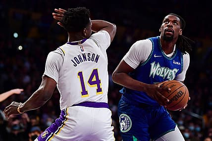 Jan 2, 2022; Los Angeles, California, USA; Minnesota Timberwolves center Naz Reid (11) moves to the basket against Los Angeles Lakers forward Stanley Johnson (14) during the first half at Crypto.com Arena. Mandatory Credit: Gary A. Vasquez-USA TODAY Sports