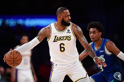 Jan 2, 2022; Los Angeles, California, USA; Los Angeles Lakers forward LeBron James (6) controls the ball in front of Minnesota Timberwolves forward Jaden McDaniels (3) during the first half at Crypto.com Arena. Mandatory Credit: Gary A. Vasquez-USA TODAY Sports