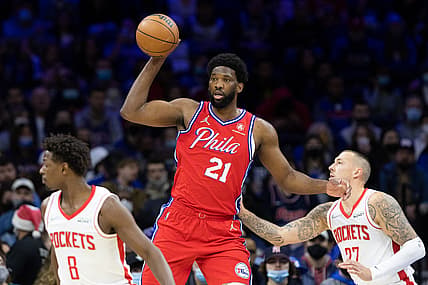 Jan 3, 2022; Philadelphia, Pennsylvania, USA; Philadelphia 76ers center Joel Embiid (21) controls the ball against Houston Rockets center Daniel Theis (27) during the first quarter at Wells Fargo Center. Mandatory Credit: Bill Streicher-USA TODAY Sports