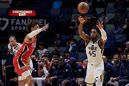 Jan 3, 2022; New Orleans, Louisiana, USA;  Utah Jazz guard Donovan Mitchell (45) passes the ball against New Orleans Pelicans center Jaxson Hayes (10) during the first half at the Smoothie King Center. Mandatory Credit: Stephen Lew-USA TODAY Sports