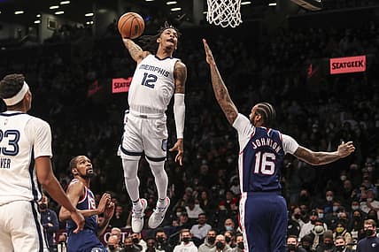 Jan 3, 2022; Brooklyn, New York, USA;  Memphis Grizzlies guard Ja Morant (12) goes in for a dunk in the third quarter against the Brooklyn Nets at Barclays Center. Mandatory Credit: Wendell Cruz-USA TODAY Sports