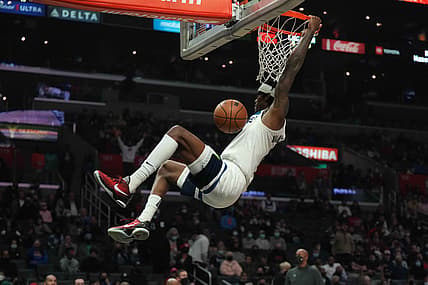 Jan 3, 2022; Los Angeles, California, USA; Minnesota Timberwolves forward Jarred Vanderbilt (8) dunks the ball in the second half against the LA Clippers at Crypto.com Arena. Mandatory Credit: Kirby Lee-USA TODAY Sports