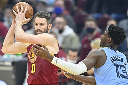 Jan 4, 2022; Cleveland, Ohio, USA; Memphis Grizzlies forward Jaren Jackson Jr. (13) defends Cleveland Cavaliers forward Kevin Love (0) in the first quarter at Rocket Mortgage FieldHouse. Mandatory Credit: David Richard-USA TODAY Sports