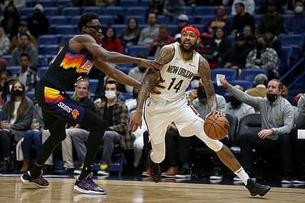 Jan 4, 2022; New Orleans, Louisiana, USA; New Orleans Pelicans forward Brandon Ingram (14) drives around Phoenix Suns forward Jalen Smith (10) in the first quarter at the Smoothie King Center. Mandatory Credit: Chuck Cook-USA TODAY Sports