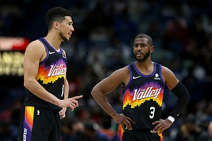 Jan 4, 2022; New Orleans, Louisiana, USA; Phoenix Suns guards Devin Booker (1) and Chris Paul (3) talks in the second half against the New Orleans Pelicans at the Smoothie King Center. Mandatory Credit: Chuck Cook-USA TODAY Sports