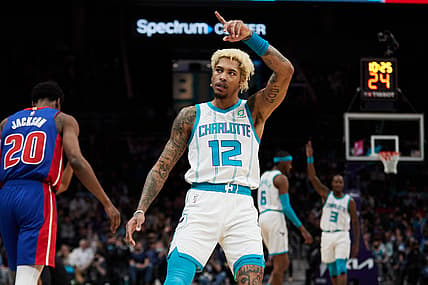 Jan 5, 2022; Charlotte, North Carolina, USA; Charlotte Hornets guard Kelly Oubre Jr. (12) reacts after hitting a three-point basket during second half action against the Detroit Pistons at Spectrum Center. Mandatory Credit: Brian Westerholt-USA TODAY Sports